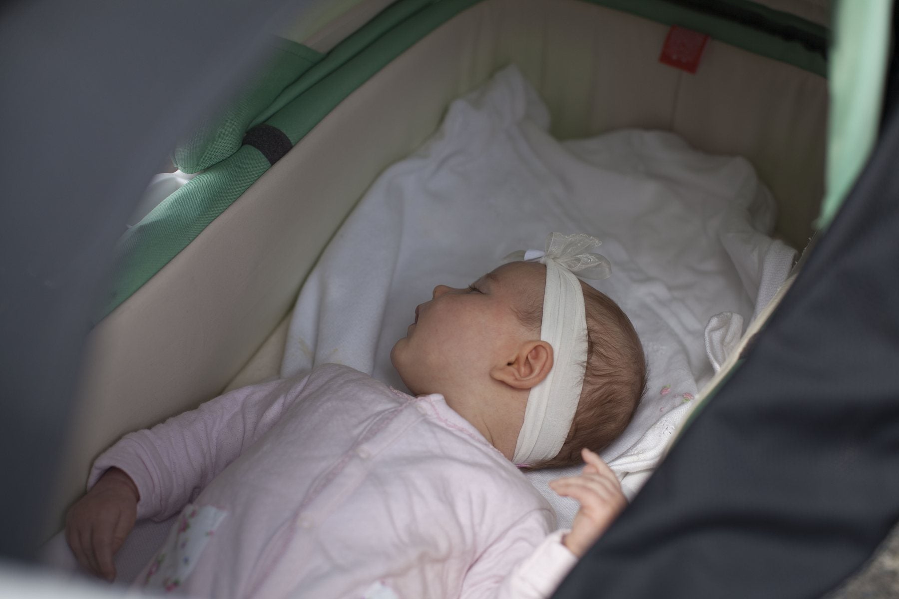 CoziGo fitted to a stroller with a baby resting inside