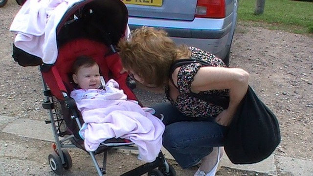 Aimee with her grandmother beside the pram